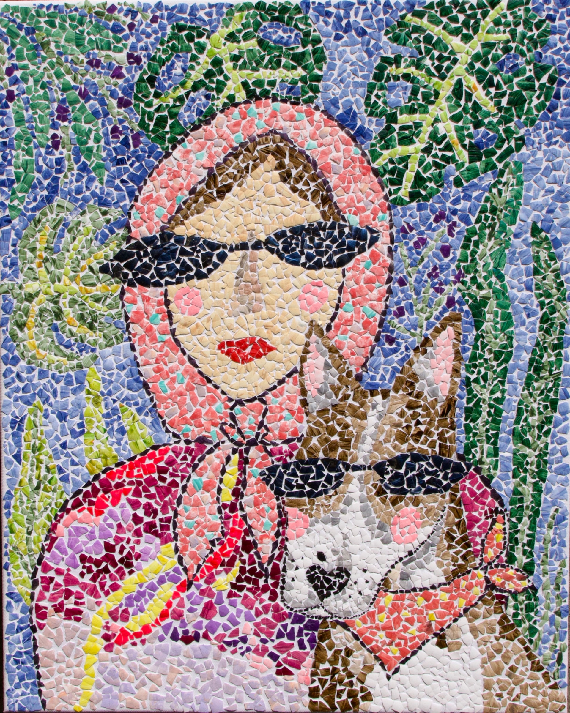 Eggshell mosaic portrait of a woman in dark sunglasses holding a small dog against green foliage